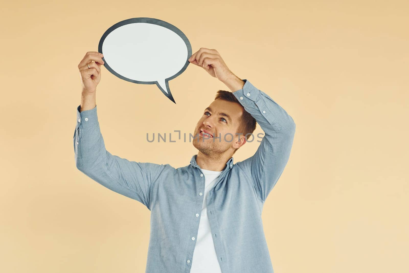 Ideas in the mind. Man standing in the studio with empty signs for the text.