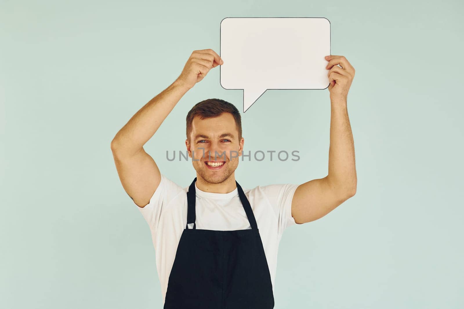 Sincere emotions. Man standing in the studio with empty signs for the text.