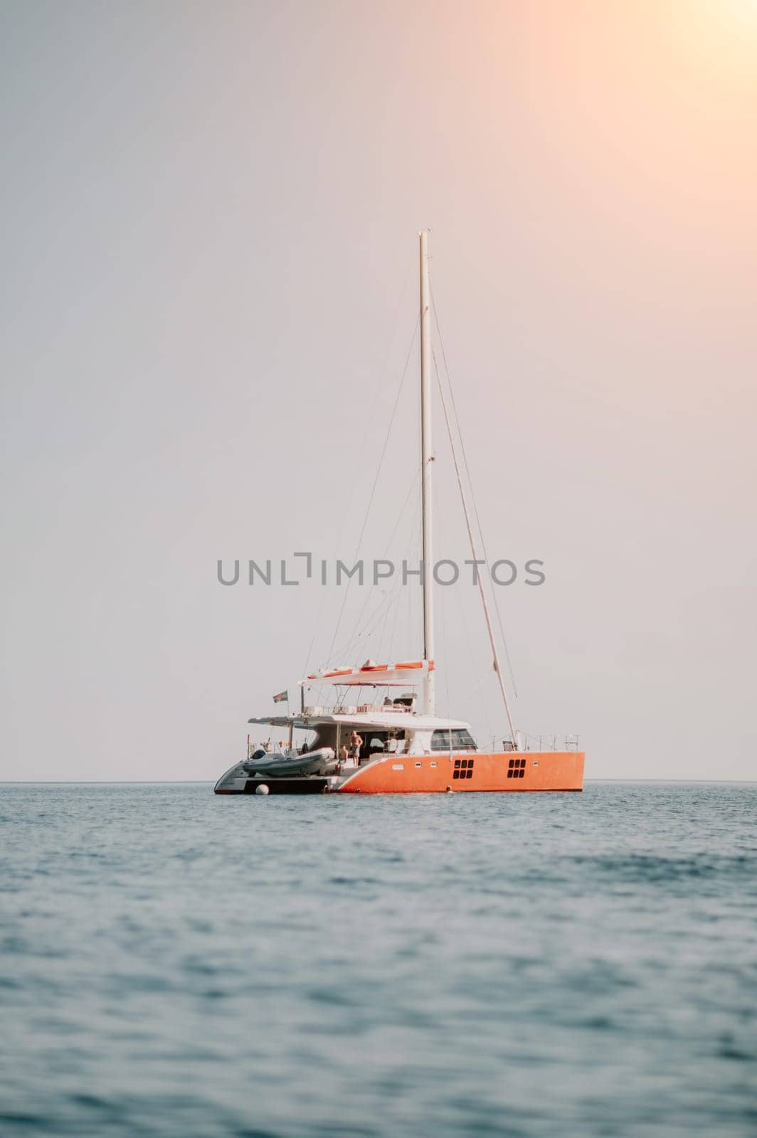 Aerial boat race. Luxury cruise trip. View from above of white boat on deep blue water. Aerial view of rich yacht sailing sea. Motor boat racing wave. Summer journey on luxury ship