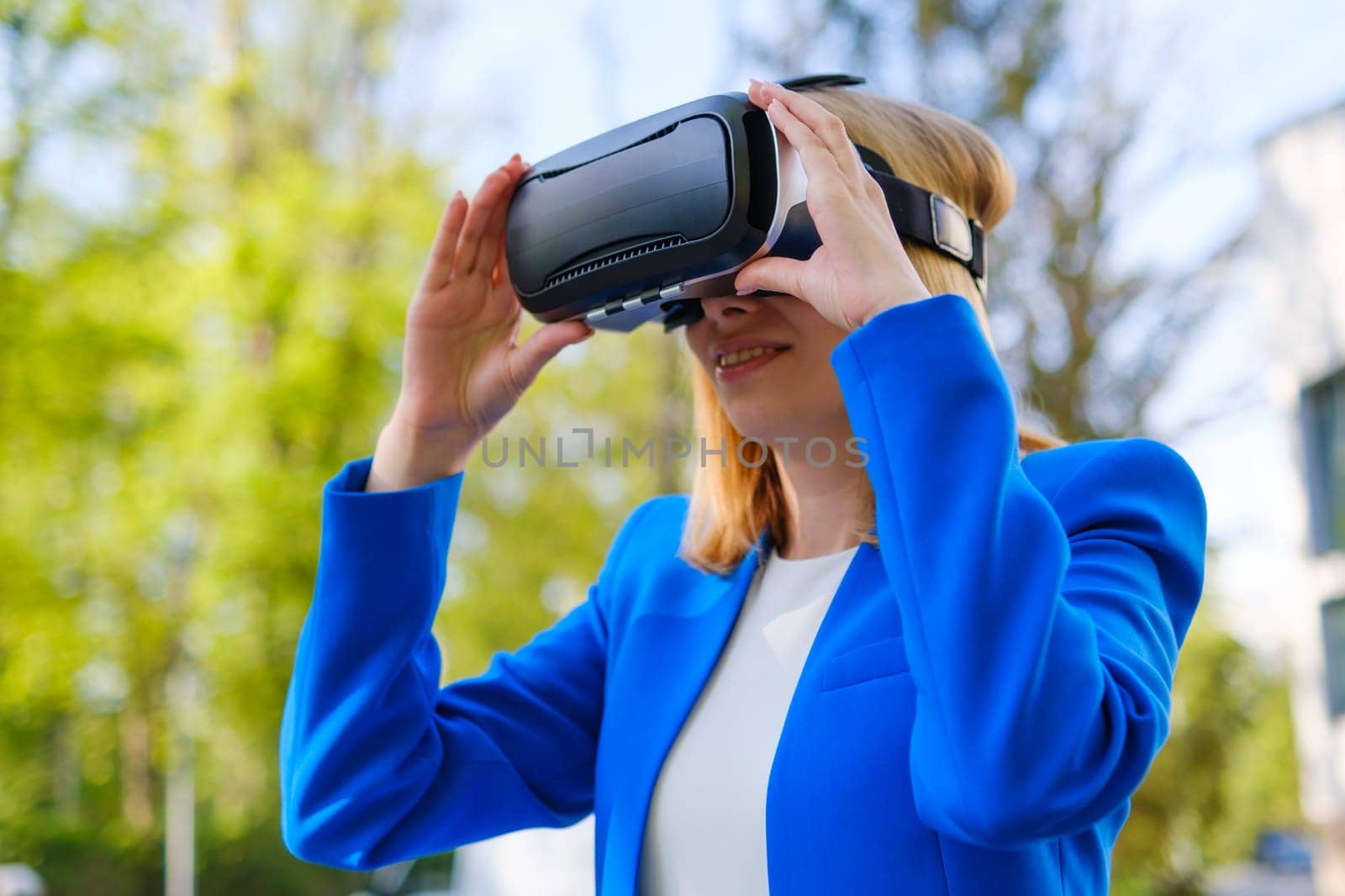 Woman with VR virtual reality goggles experiences a metaverse world. Augmented reality technology concept