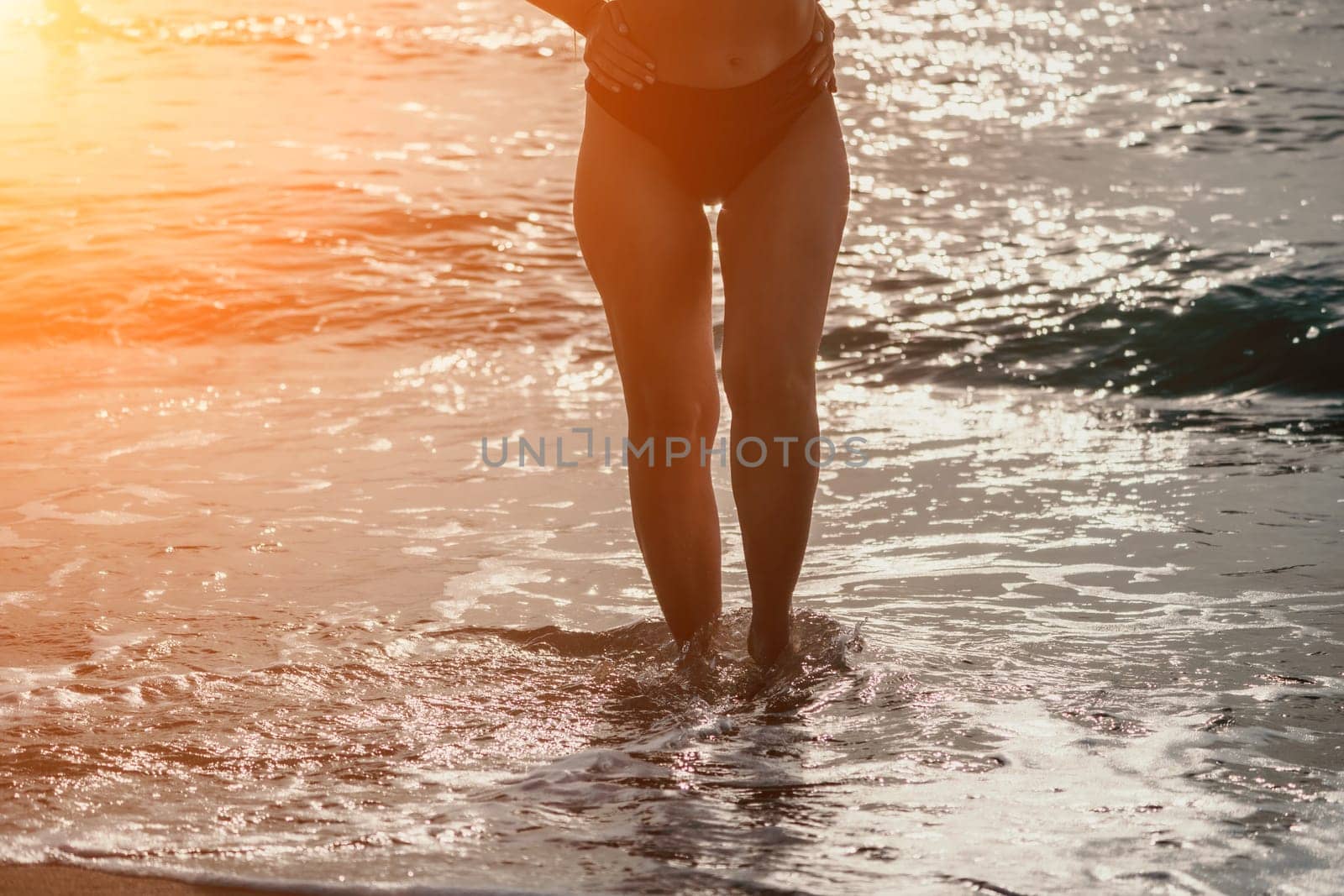 Woman summer travel sea. Happy woman enjoying her summer travels, captured in a lower body portrait, taking photos to preserve her memories of the scenic sea beach sharing travel adventure journey by panophotograph
