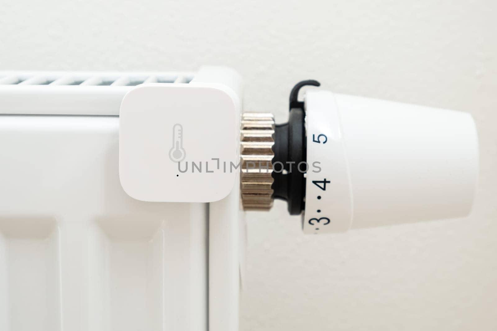 Smart heat sensor on the battery for temperature control. The increasing price of gas and heating concept
