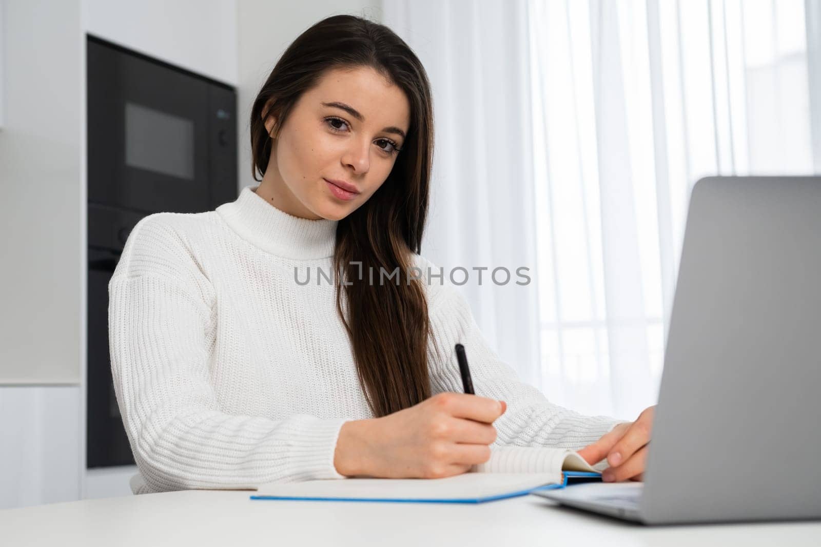 Beautiful student enhancing her future by attending online lectures.