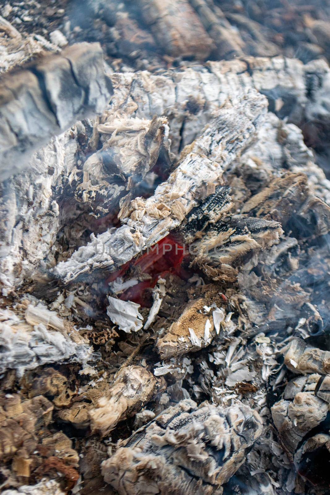 A piece of broken glass with smoke coming out of it. High quality photo