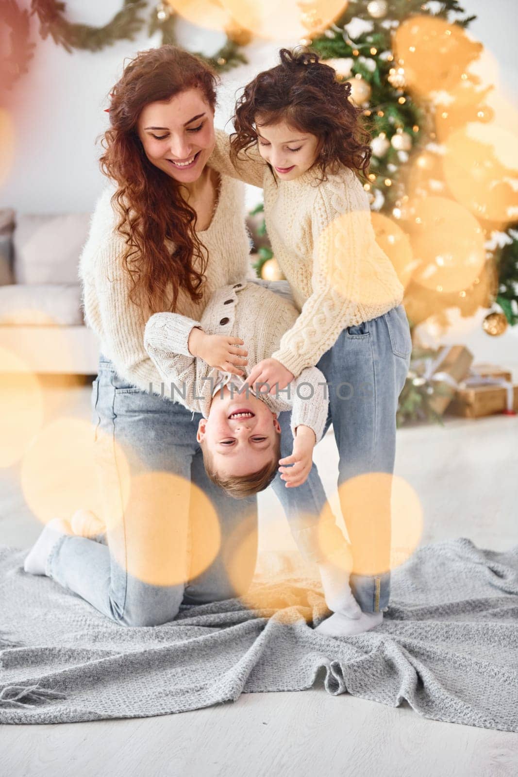 Mother celebrating new year with her children at home.