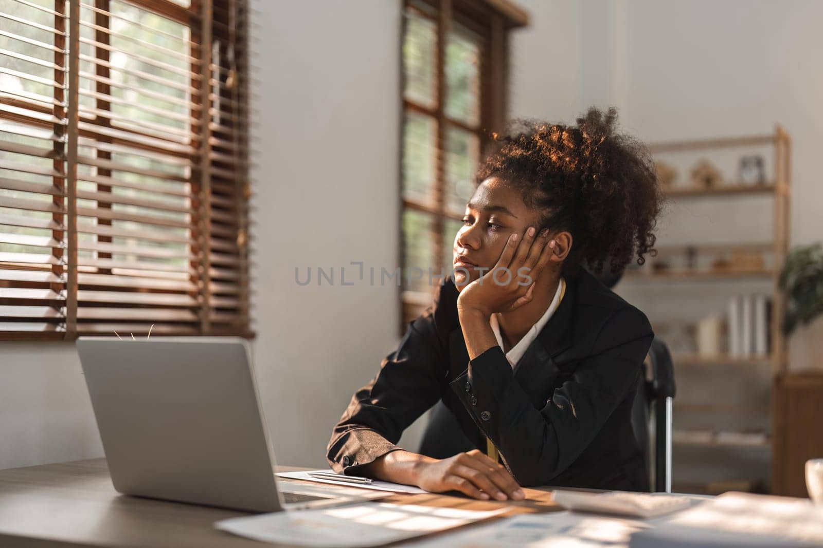 Tired, lazy and frustrated black woman, business stress and burnout at office desk by nateemee