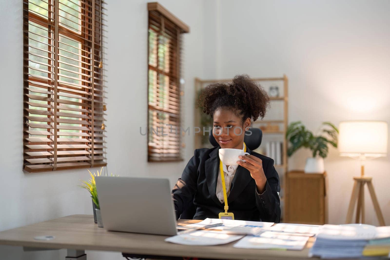 Accountant black woman working on laptop and do document, tax, exchange, accounting and Financial advisor concept by nateemee