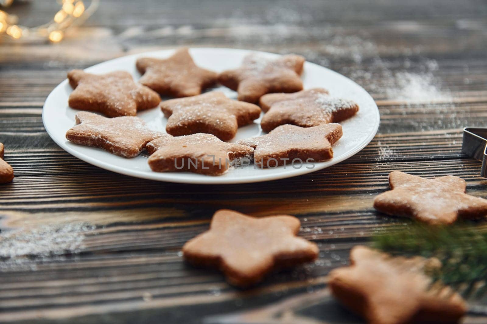 Cookies is on the plate. Christmas background with holiday decoration.