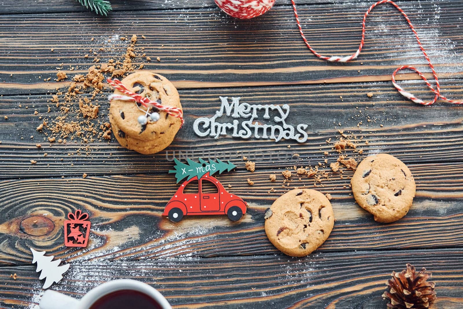 Red toy car. Christmas background with holiday decoration.