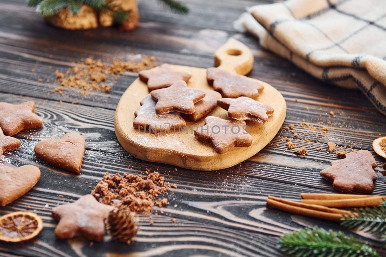 Cookies laying down on the table. Christmas background with holiday decoration.