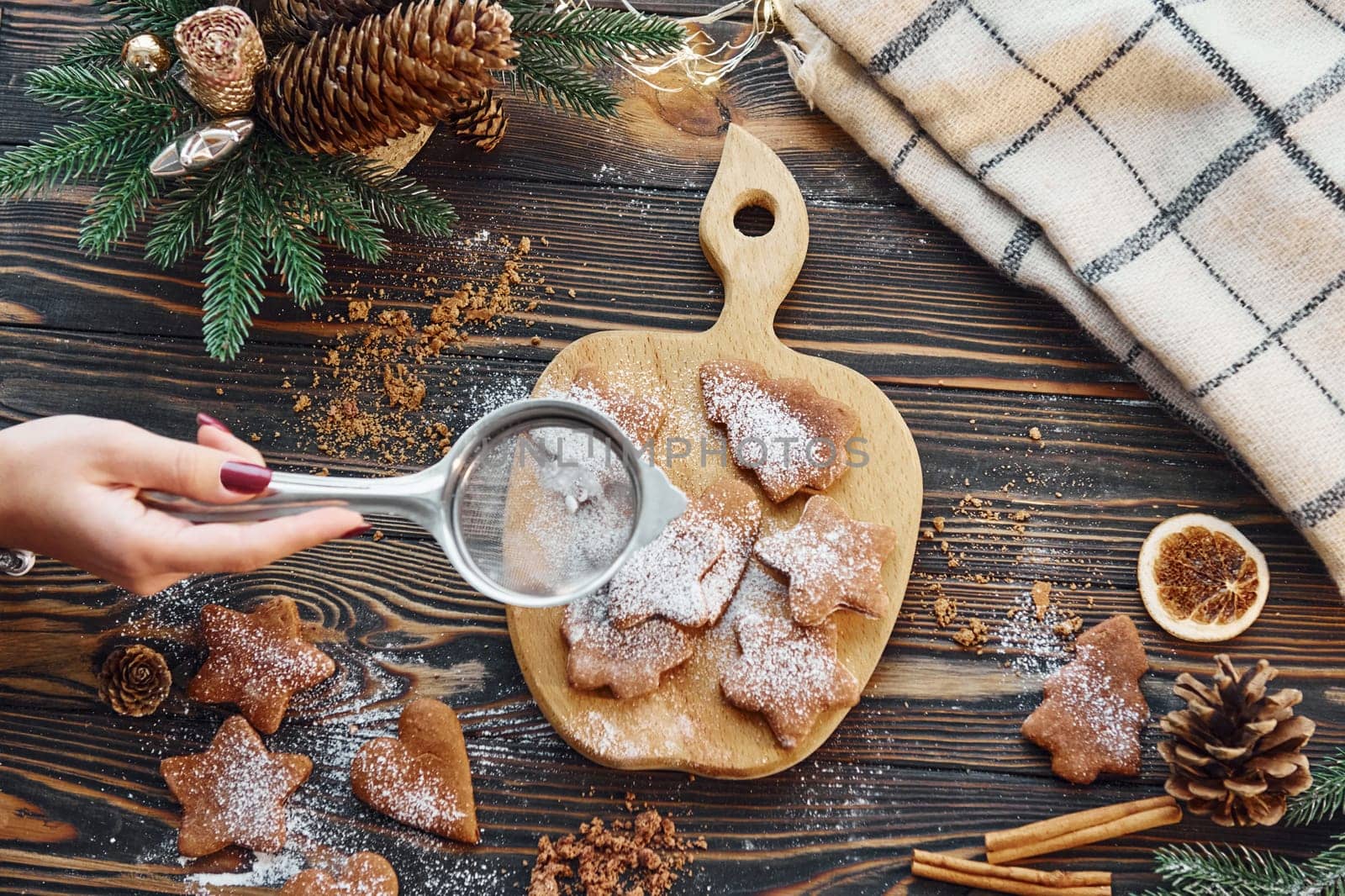 With woman hands. Christmas background with holiday decoration.