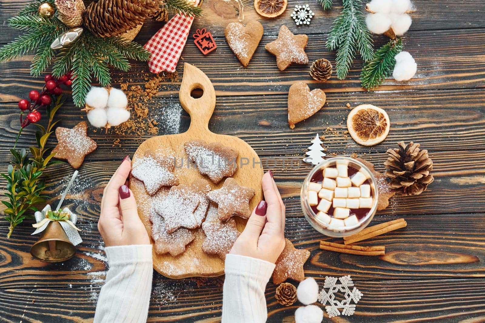 Woman decorating the table. Christmas background.