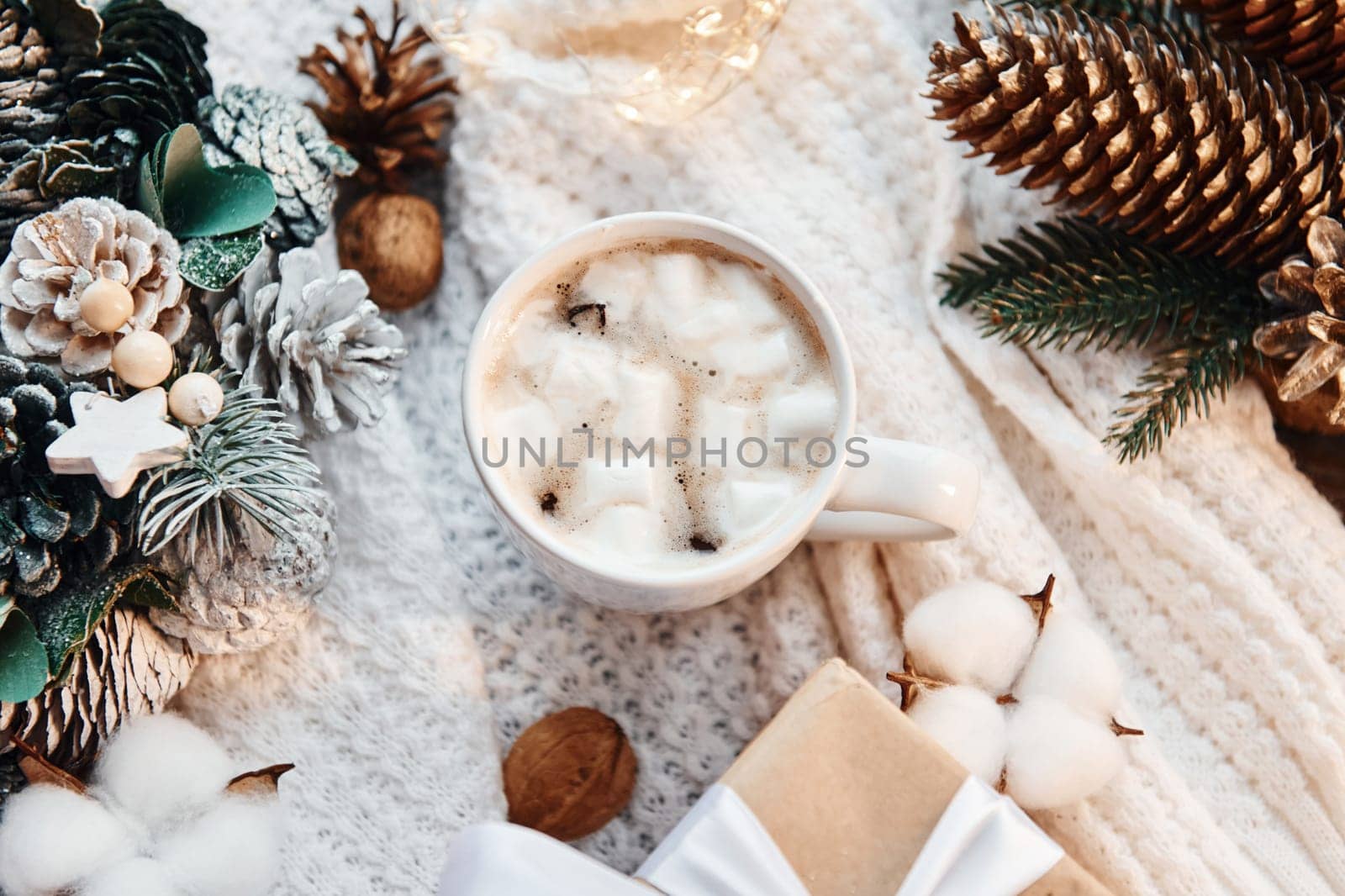 Drink in cup with marshmallow. Christmas background with holiday decoration.