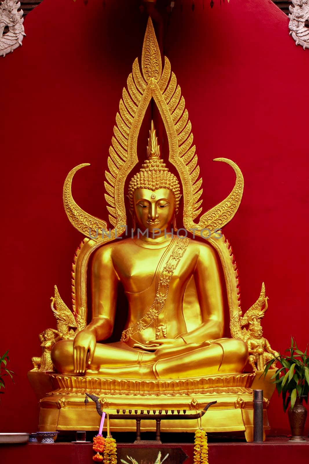 Beautiful Statue of Buddha on red background in thailand. Buddhism.