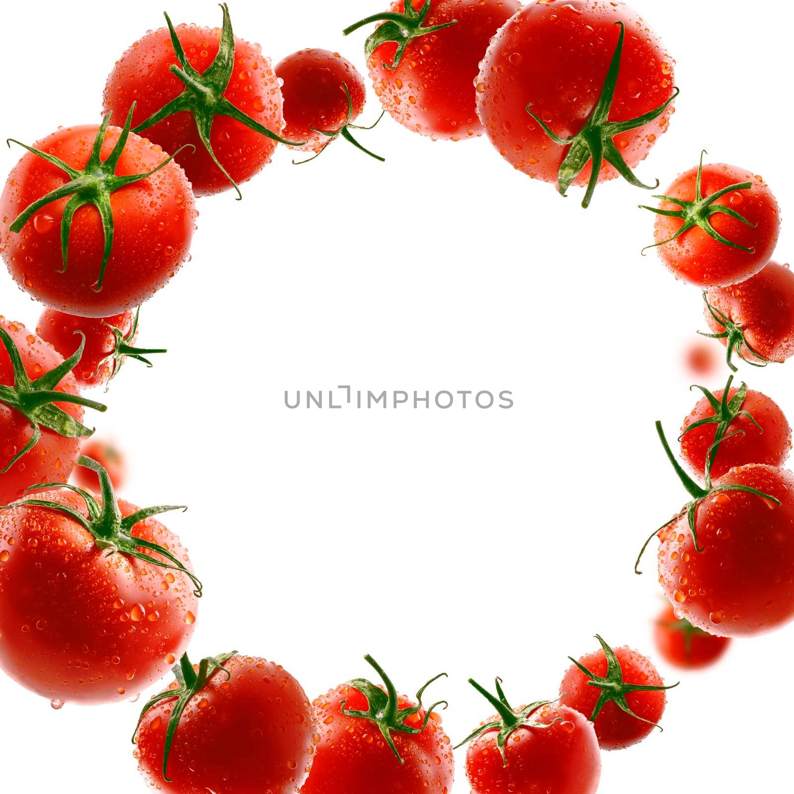 Red tomatoes levitate on a white background.