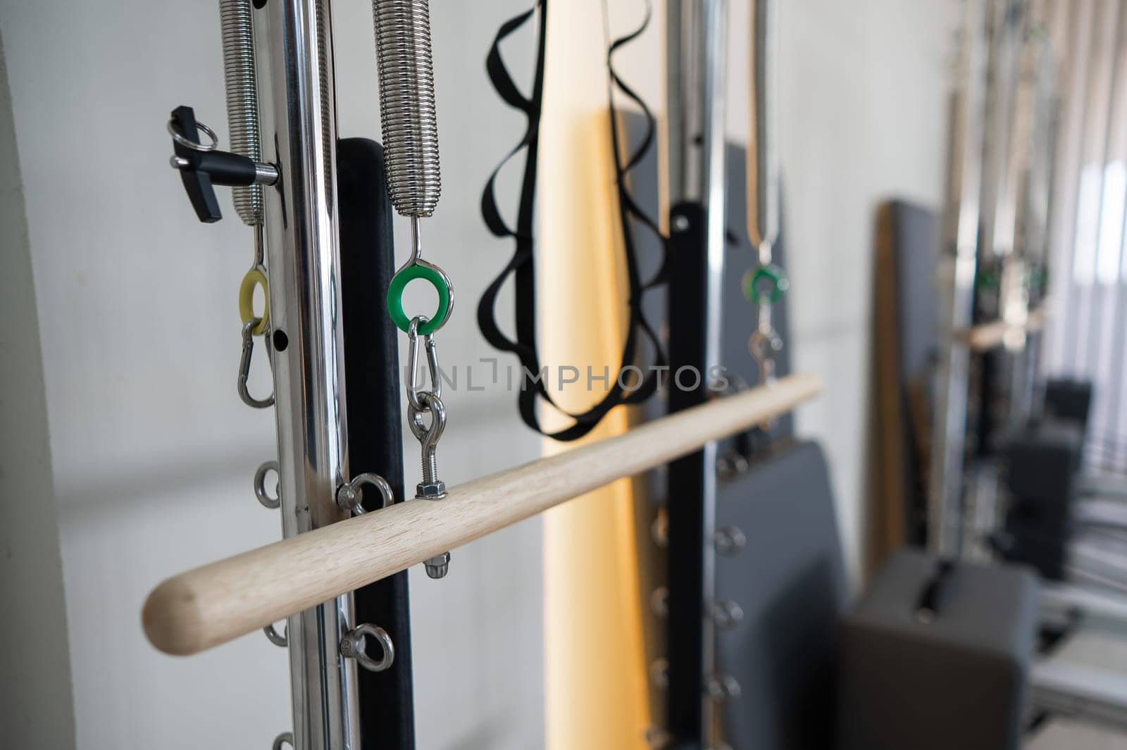 Close-up of a detail of a reformer machine. Pilates studio without people