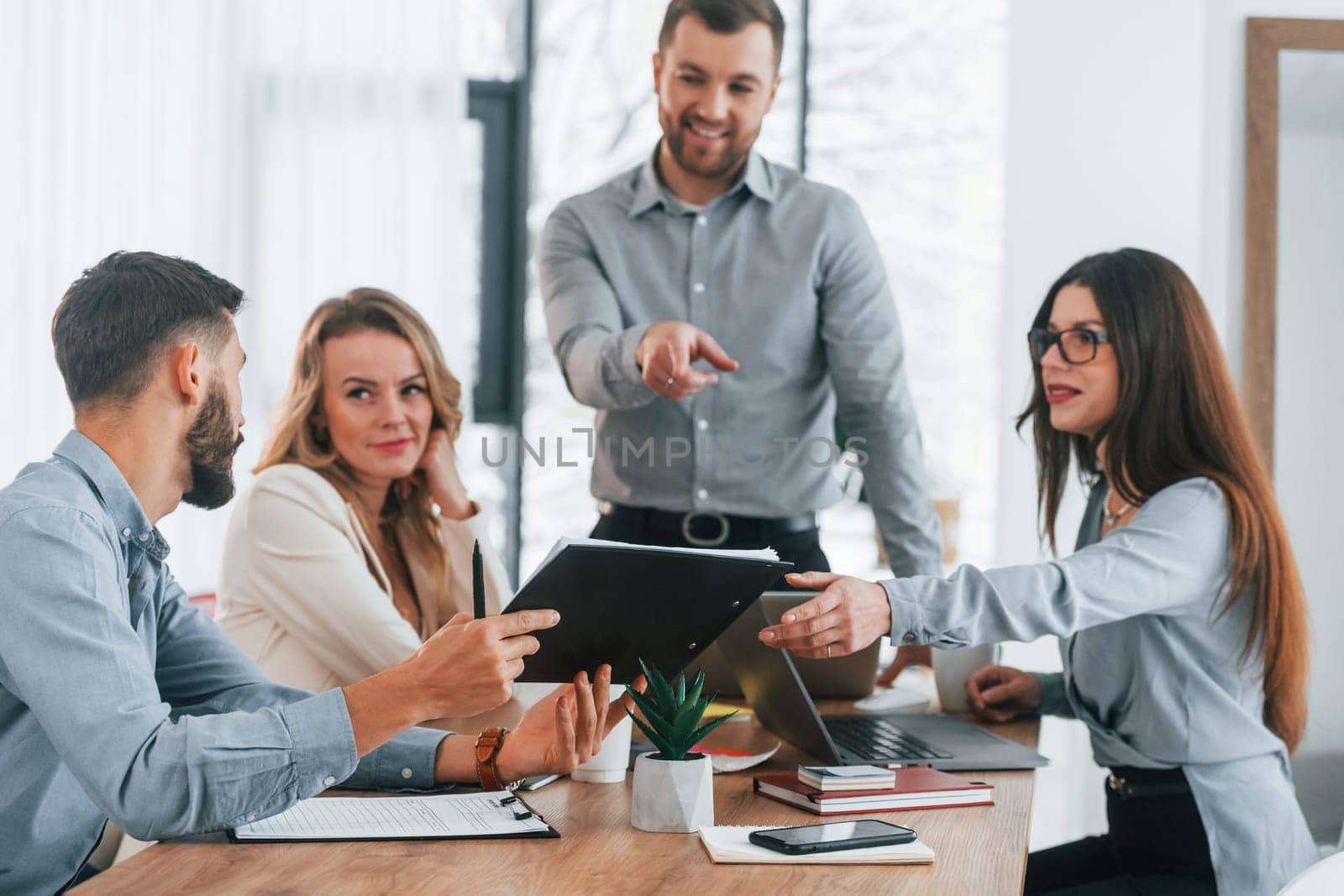Modern office. Group of business people that working on the project.