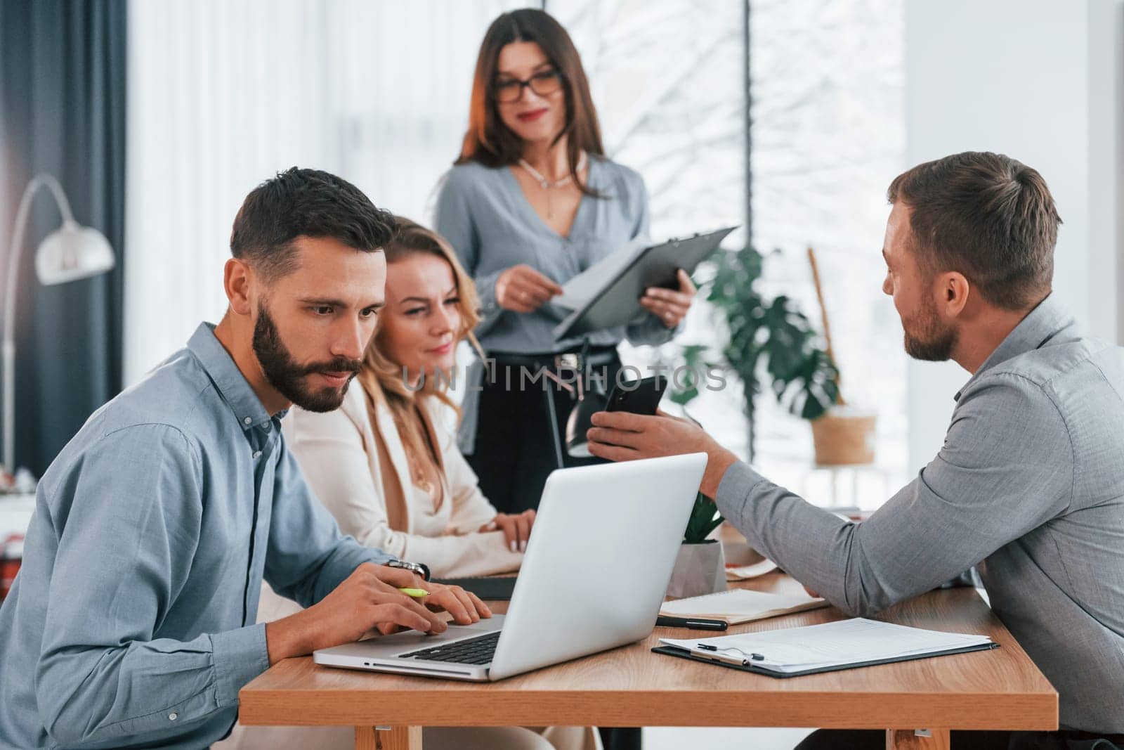 Modern technologies. Group of business people that working on the project in the office.