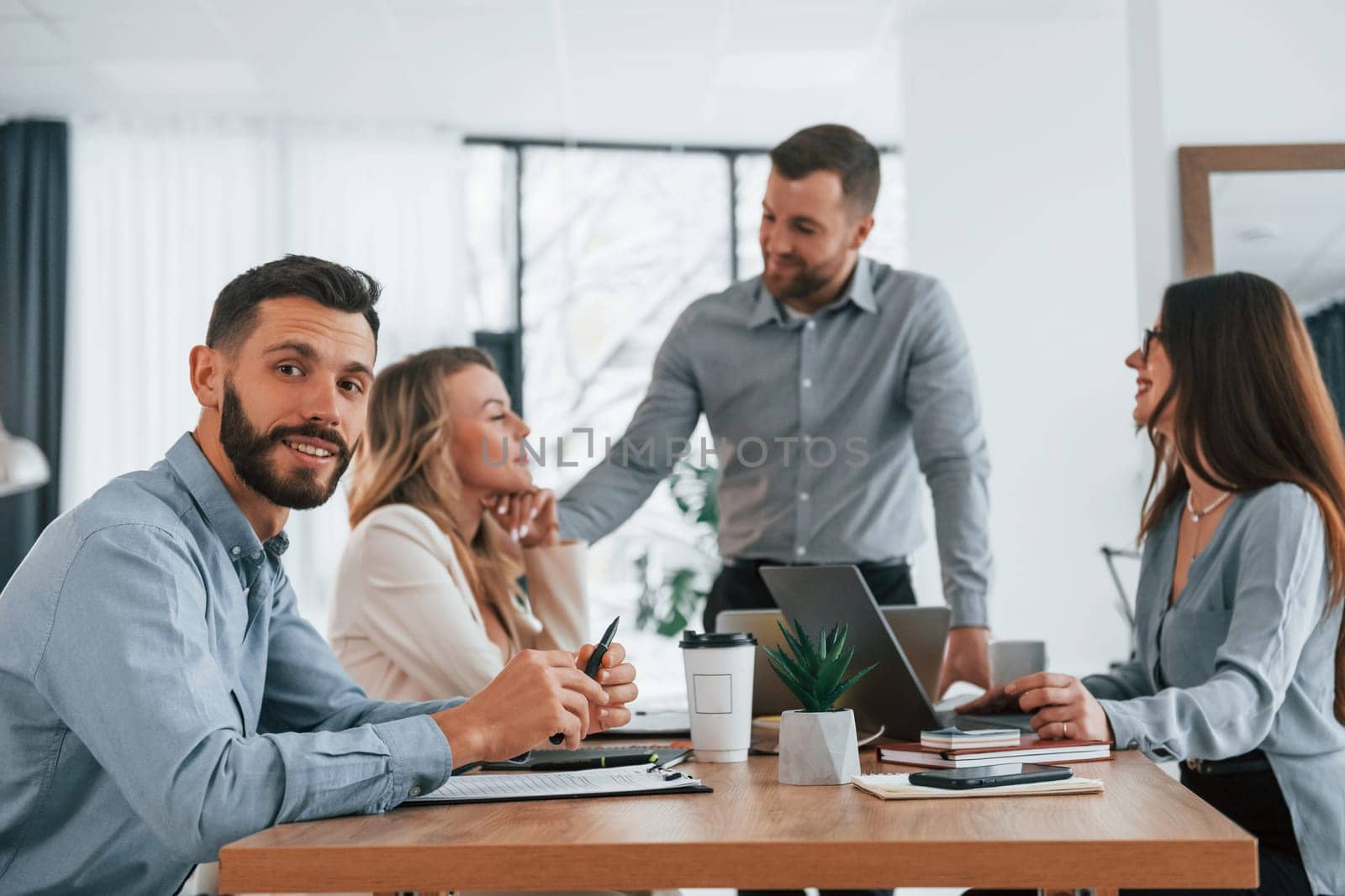 Conception of success. Group of business people that working on the project in the office.