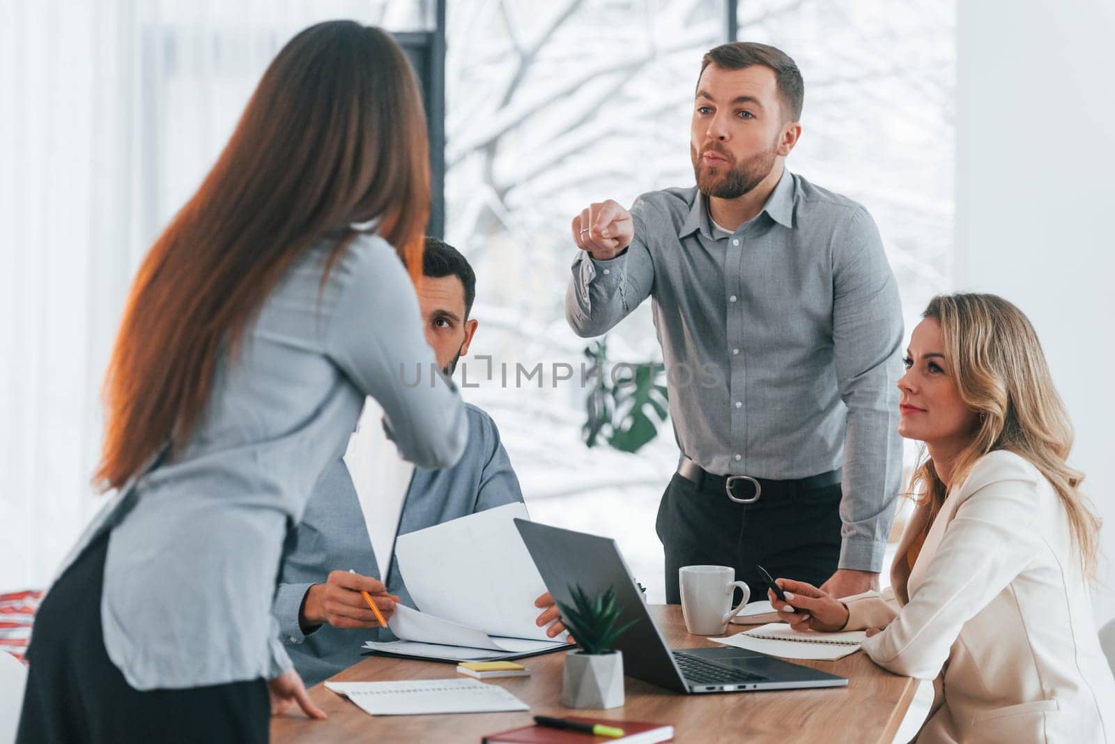 Active conversation. Group of business people that working on the project in the office.