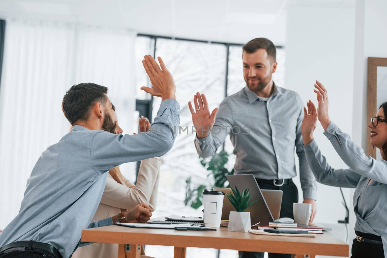 Using brainstorming technique. Group of business people that working on the project in the office.