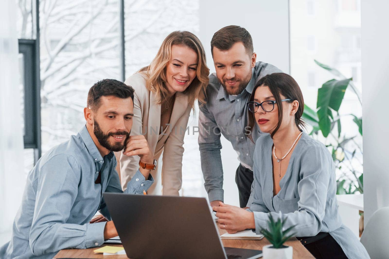 Internet connection by using laptop. Group of business people that working on the project in the office.