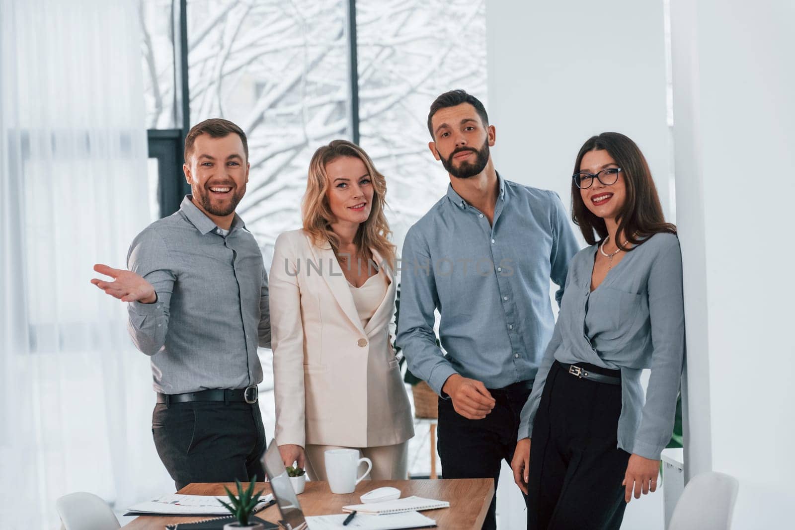 Standing together. Group of business people that working on the project in the office.
