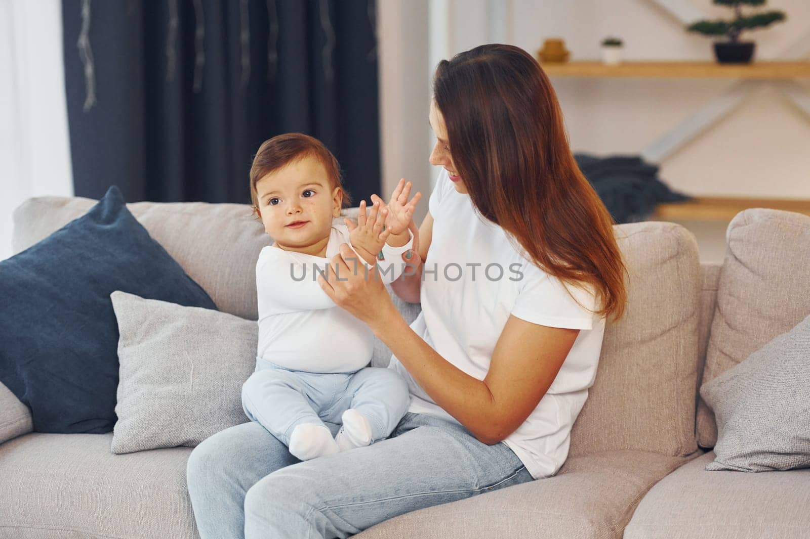 Conception of parenting. Mother with her little daughter is at home together.