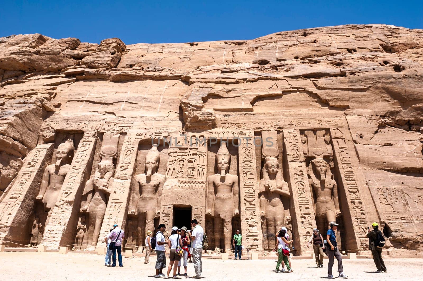 Abu Simbel, Aswan, Egypt - April 18 2008: Tourists visiting the archaeological site of Abu Simbel, Aswan, Egypt