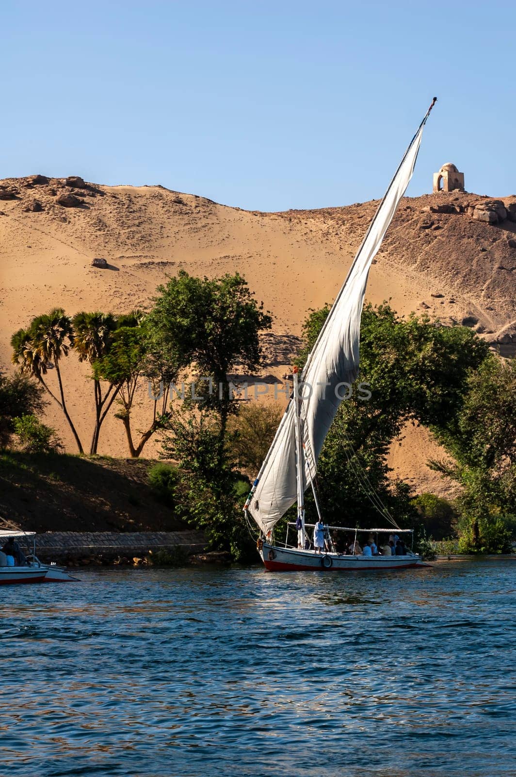 Abu Simbel, Aswan, Egypt - April 18 2008: Feluccas - traditional egyptian boat - on Nile river, Egypt.