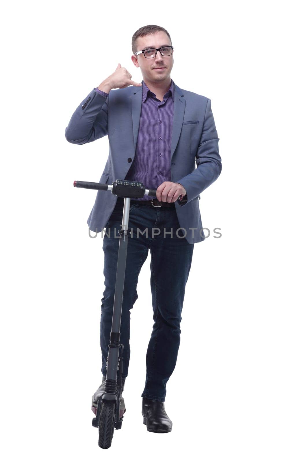 Full length portrait of an young businessman riding a scooter and showing ok. Concept of success