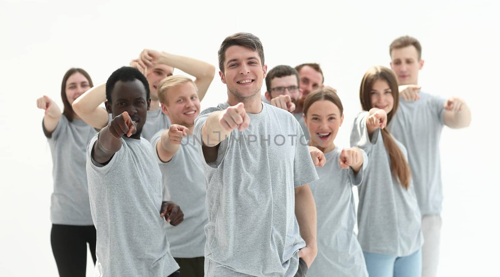 group of confident young men pointing at you. photo with copy space