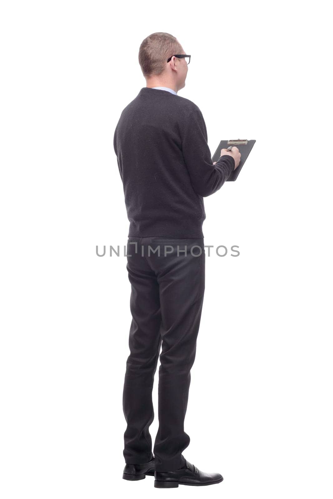 Back view of businessman writing on a clipboard isolated over white background