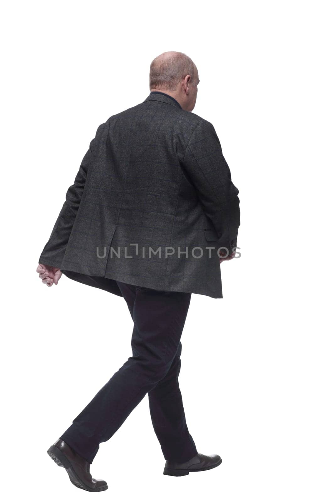 rear view. business man walking away. isolated on a white background
