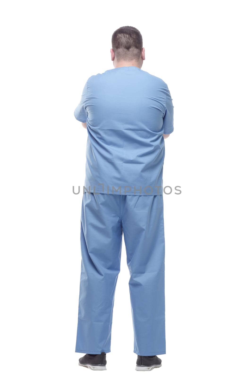rear view. a male medic in a blue uniform . isolated on a white background.