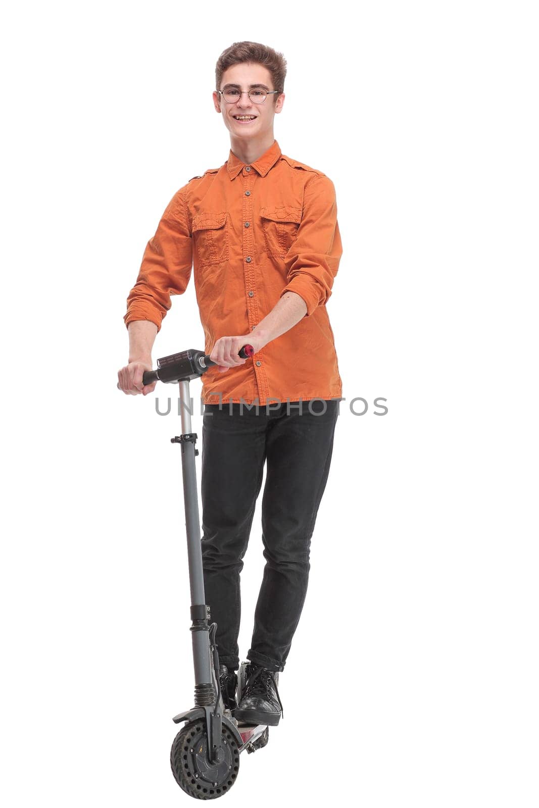Pleasant smiling man riding a kick scooter isolated white background