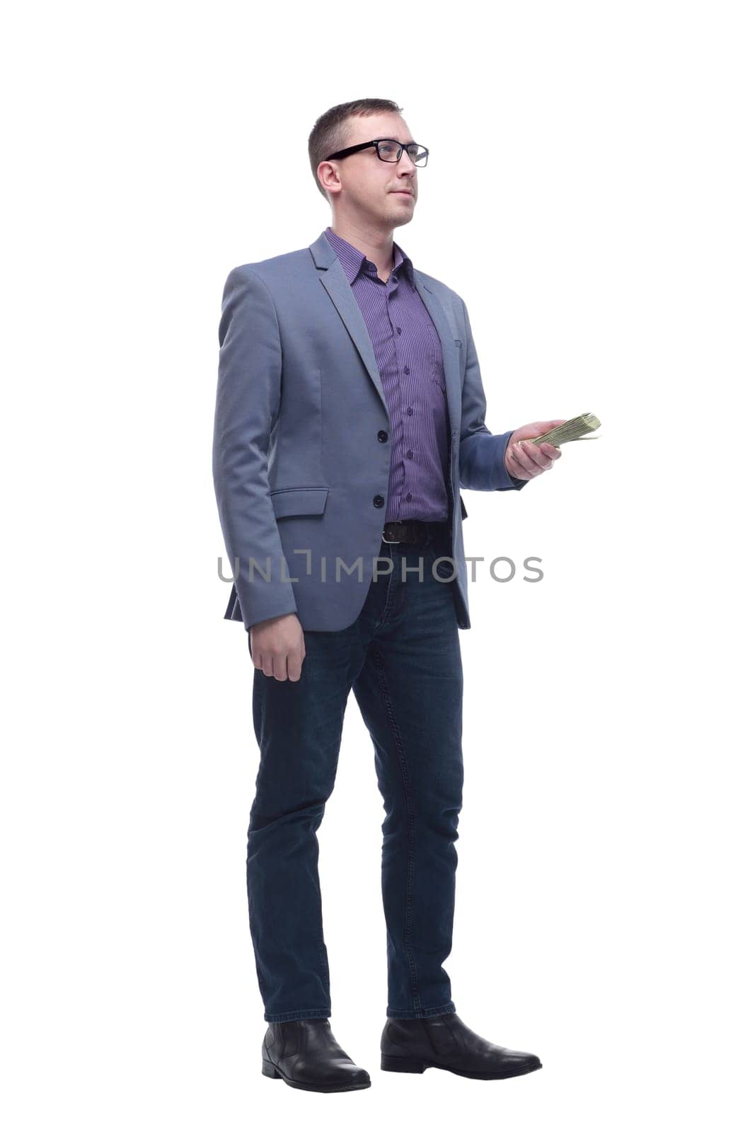 Full lenth portrait of a business man holding money, isolated on white