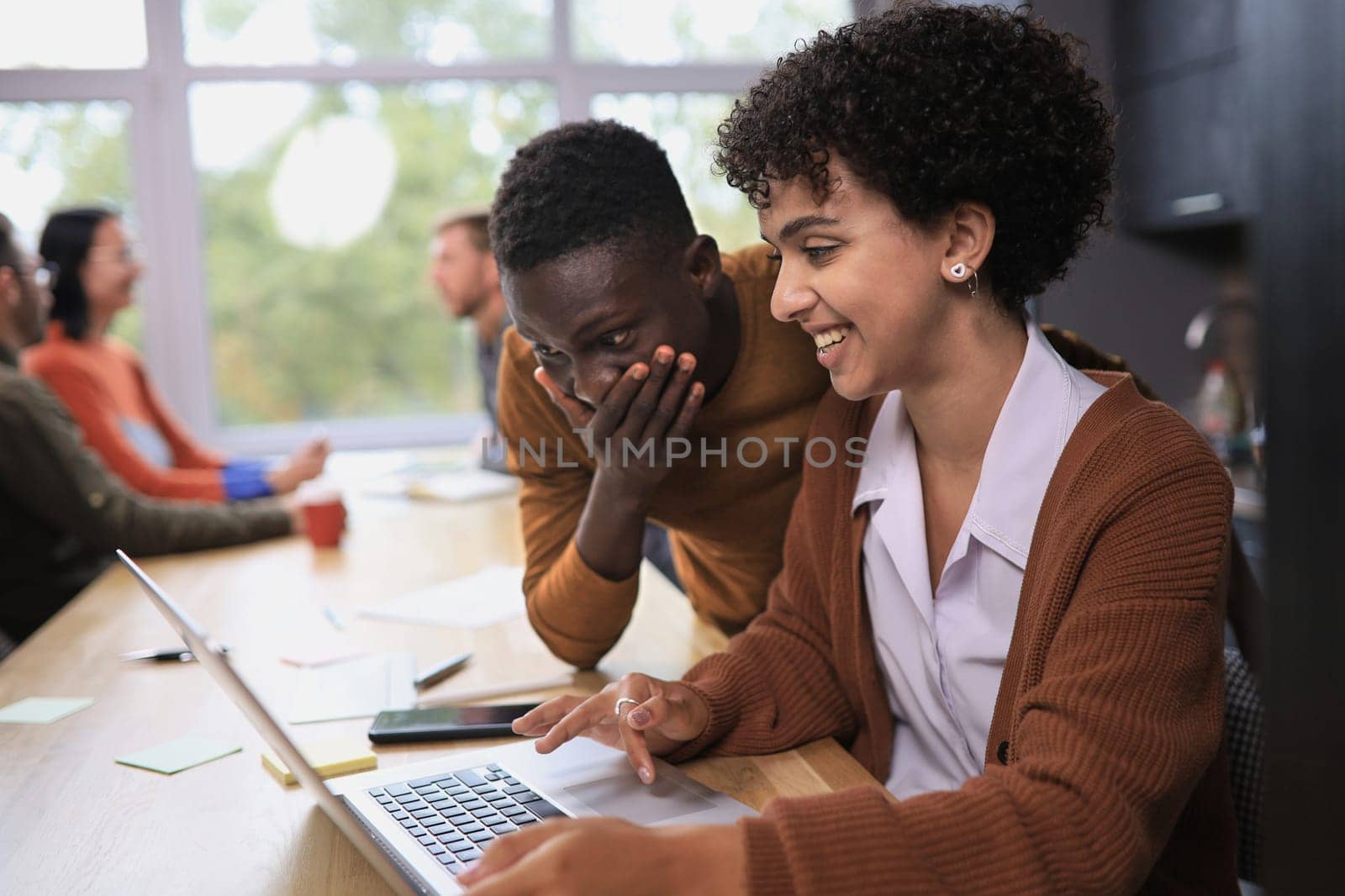 business concept. professional man and woman are discussing a new project. team in the background