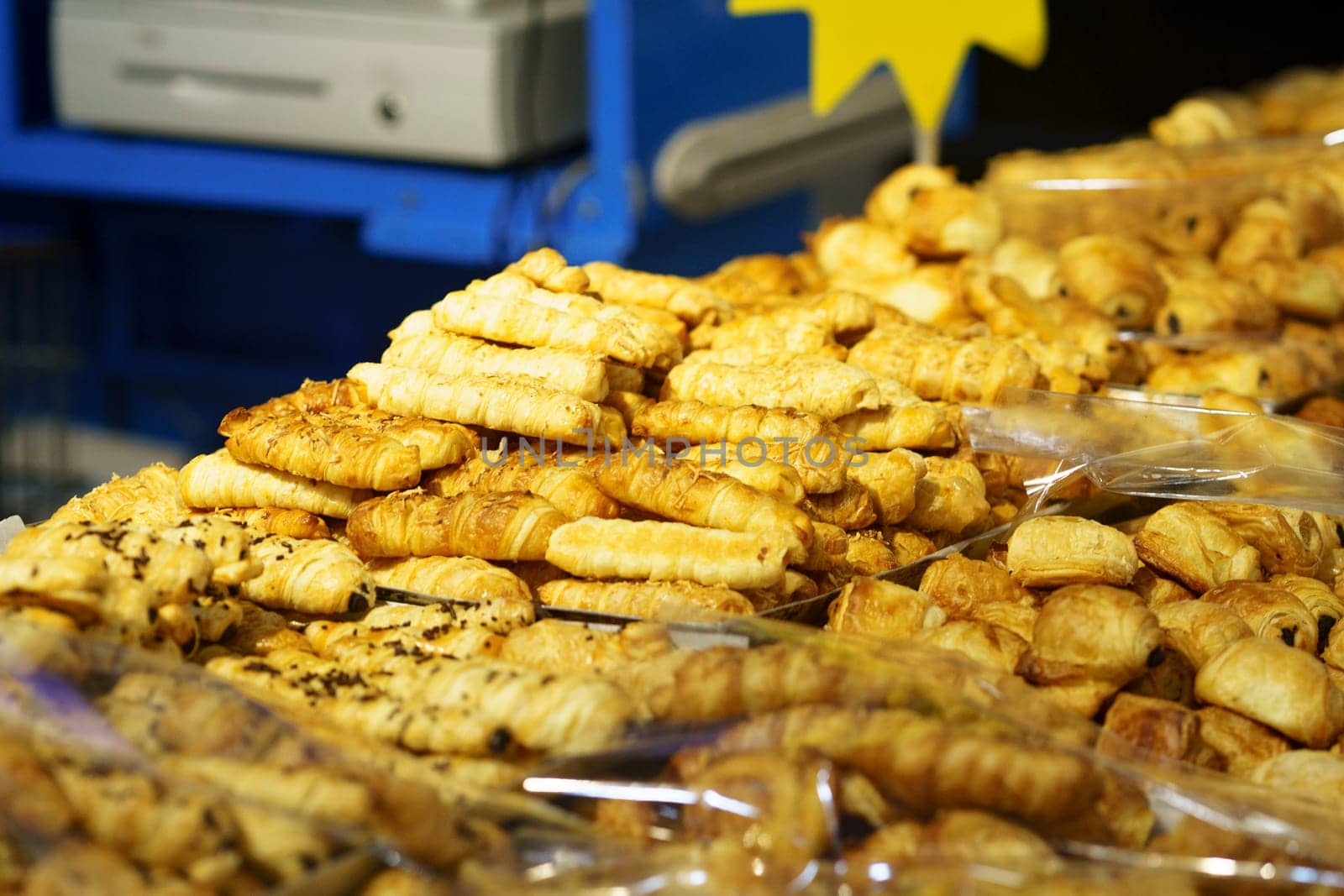 Sale of Cheese croissants and other pastries on the counter in the Supermarket in Surabaya, Indonesia. Selectieve focus and defocused.