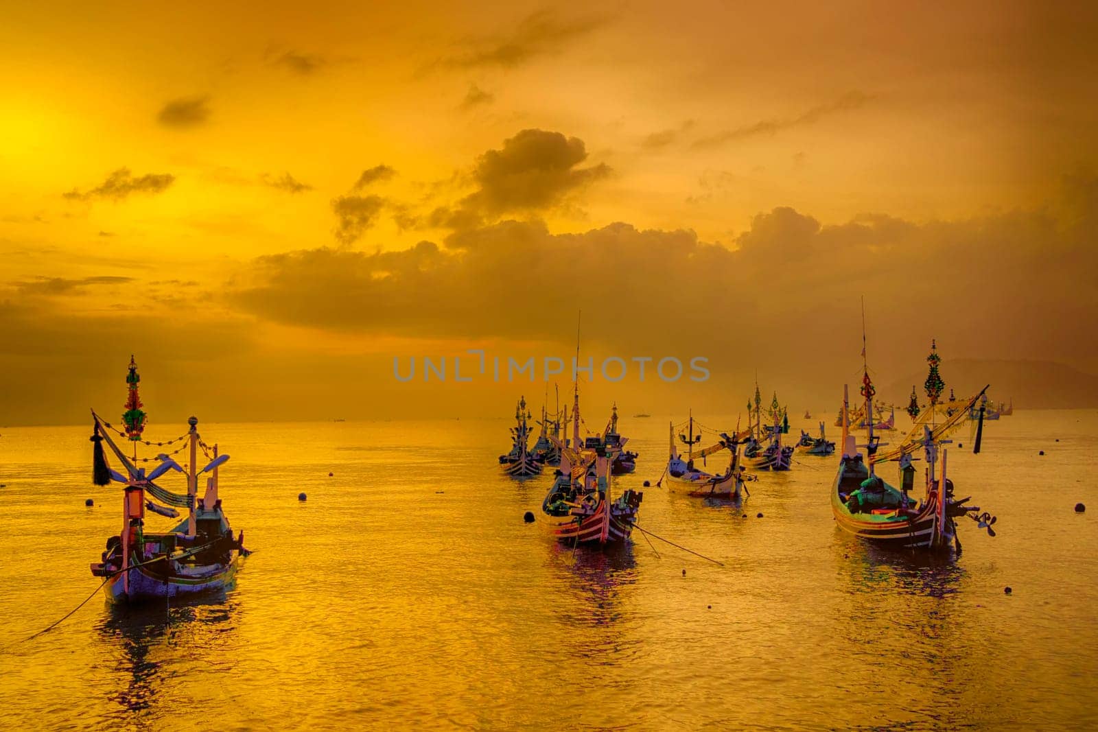 Shaky boats in long exposure photography : Moored boats during sunrise in Satelit Beach Banyuwangi