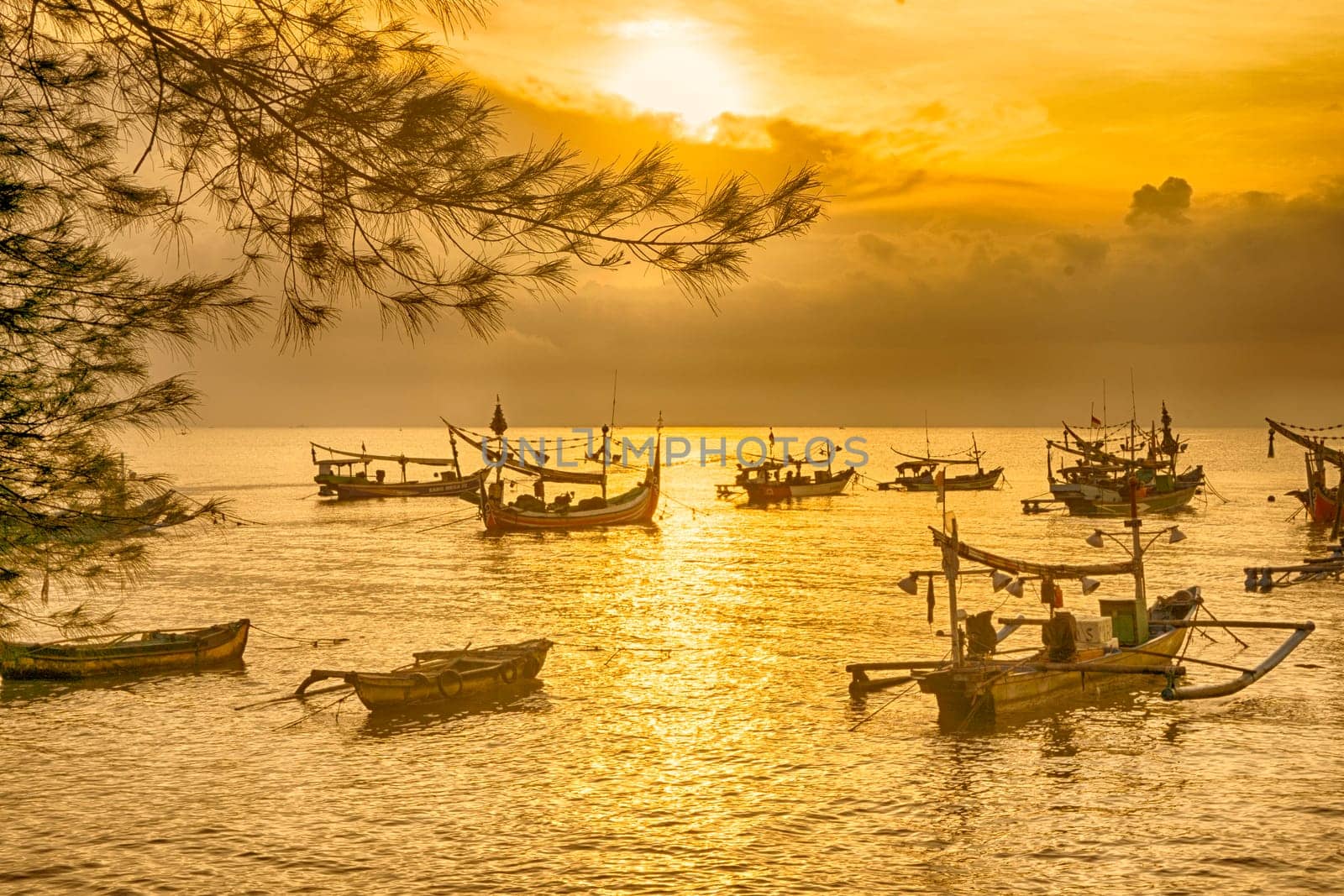 Shaky boats in long exposure photography : Moored boats during sunrise in Satelit Beach Banyuwangi