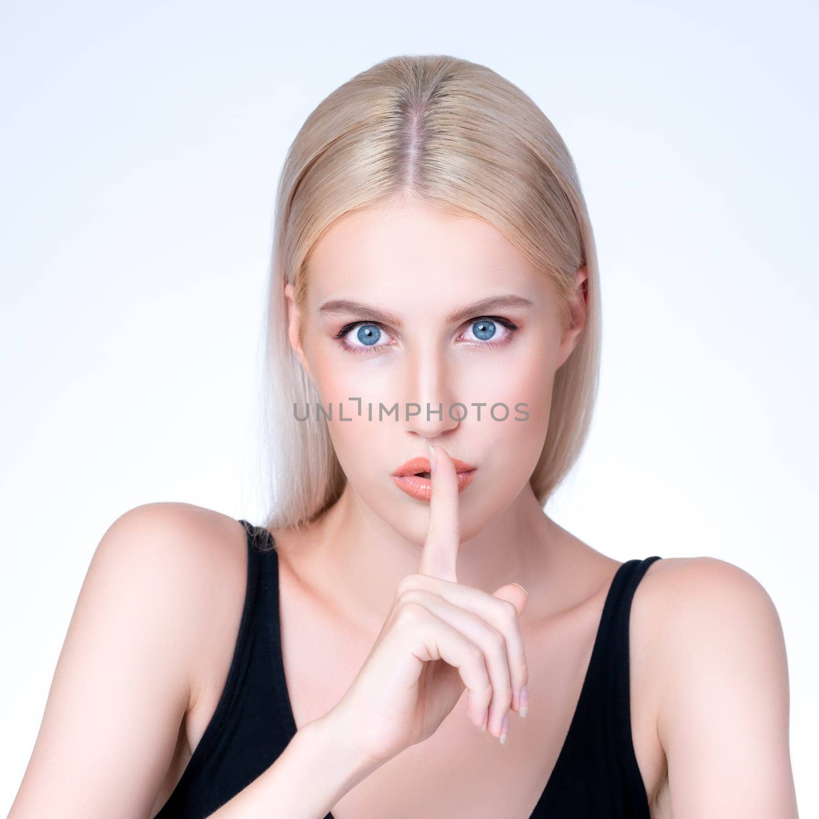 Closeup personable beautiful woman portrait with perfect smooth clean skin and natural makeup portrait in isolated background. Hand gesture with expressive facial expression for beauty model concept.