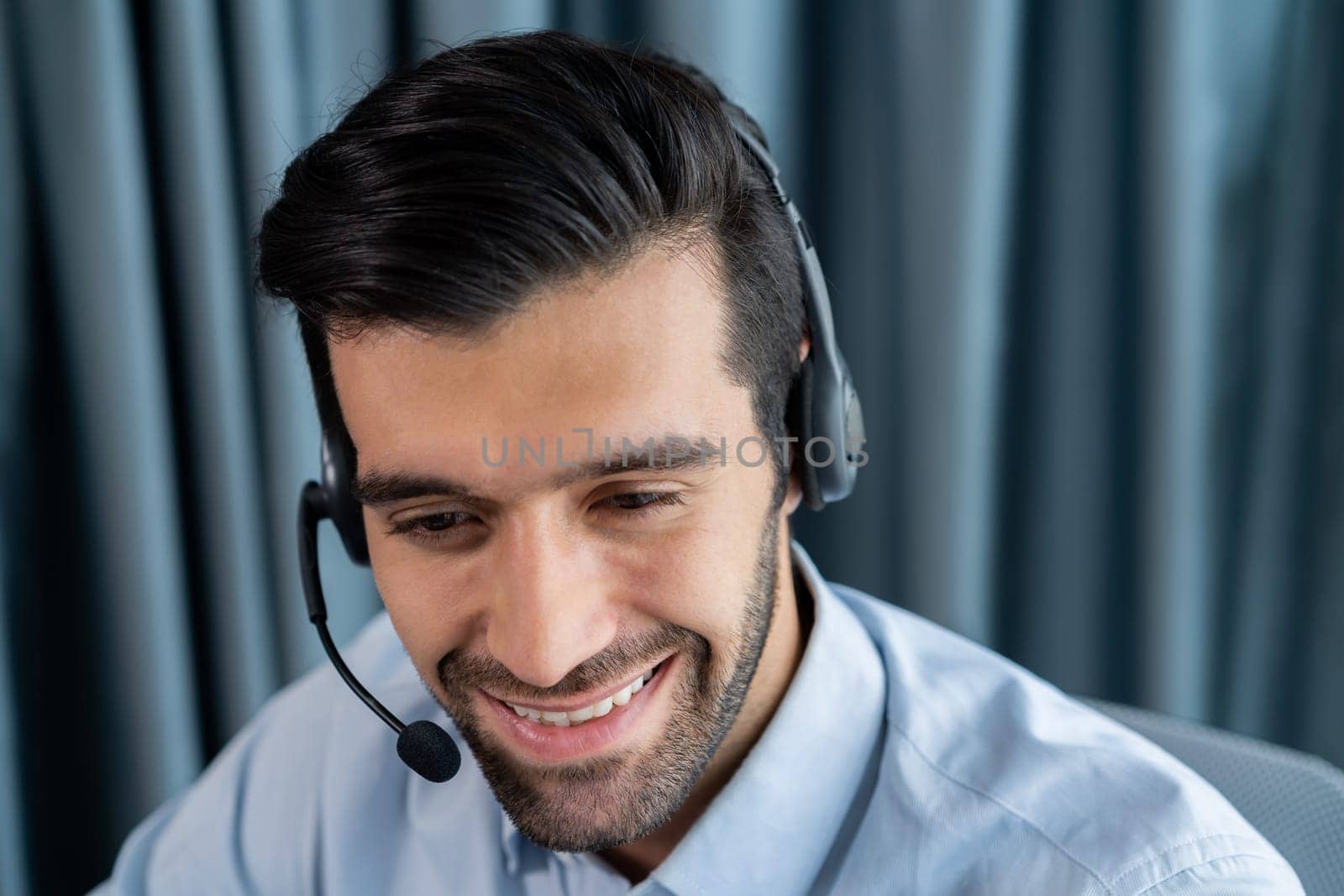 Male call center operator or telesales agent portrait. fervent by biancoblue