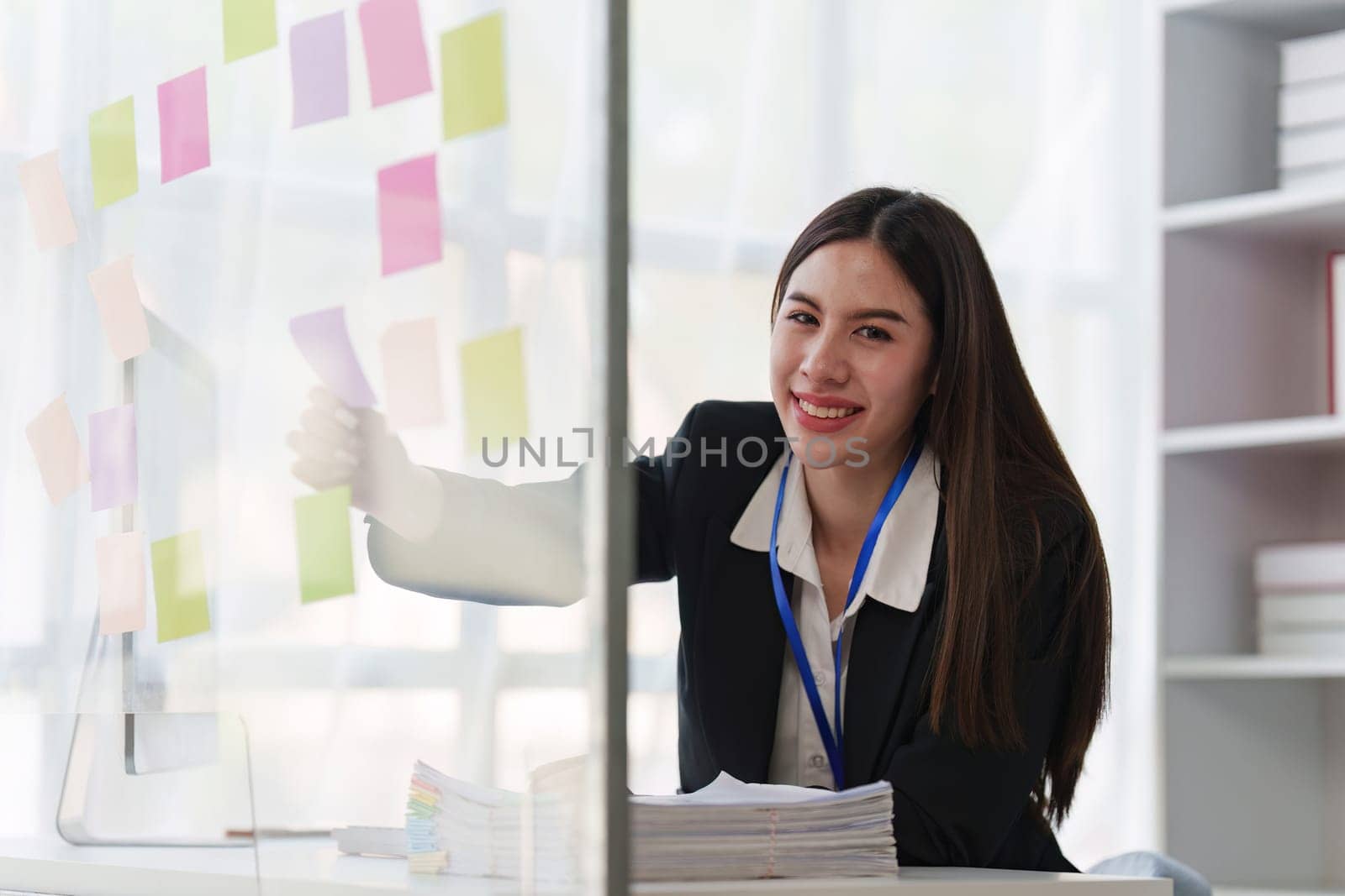 Asian Business person makes analysis and research financial report at office, analyzes profits. Accountant checks status of financial.