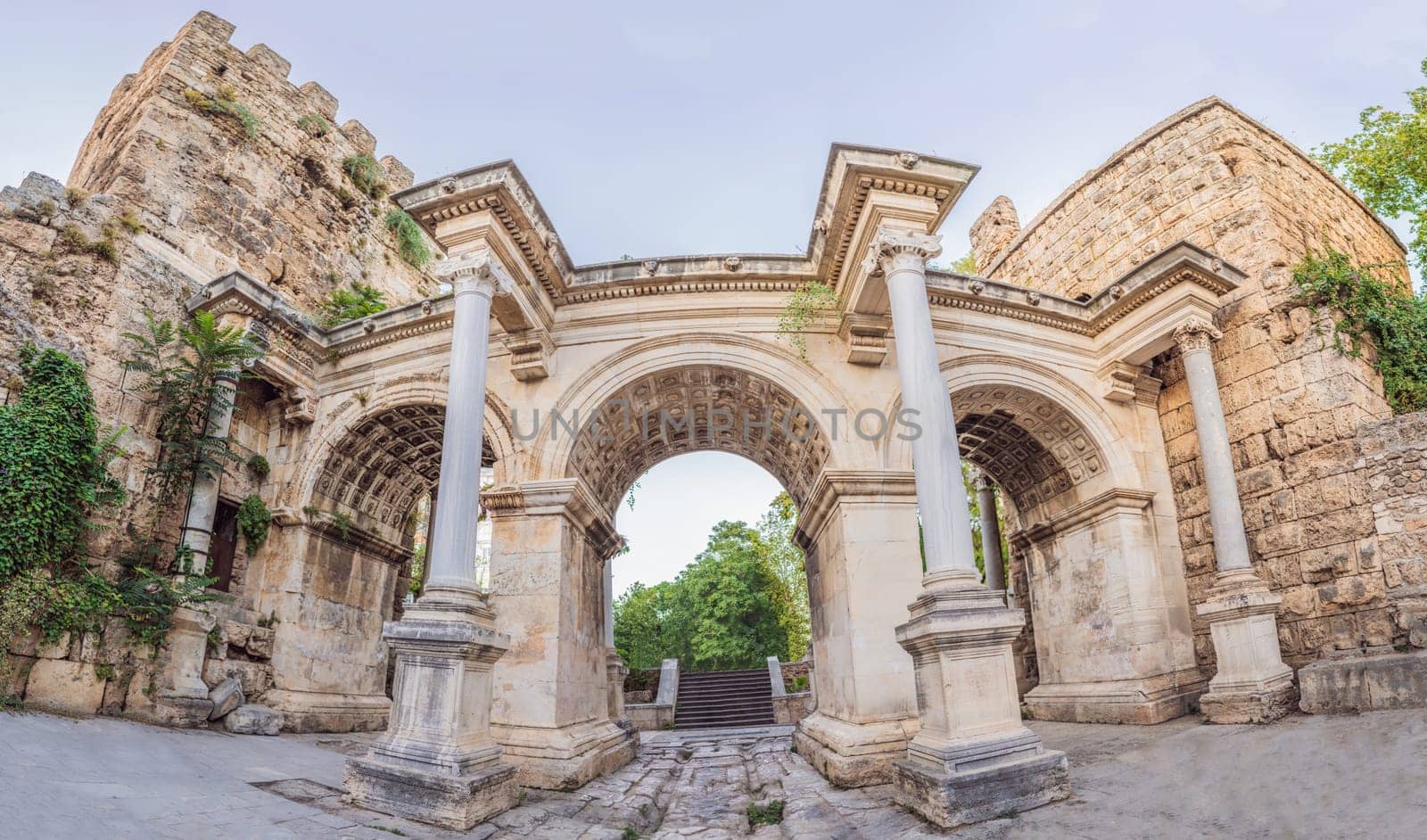Hadrian Kapisi turkey landmark city history. Popular tourist attraction - ancient Roman Hadrian Gate in old town Antalya, Turkey on a summer day. Turkiye.