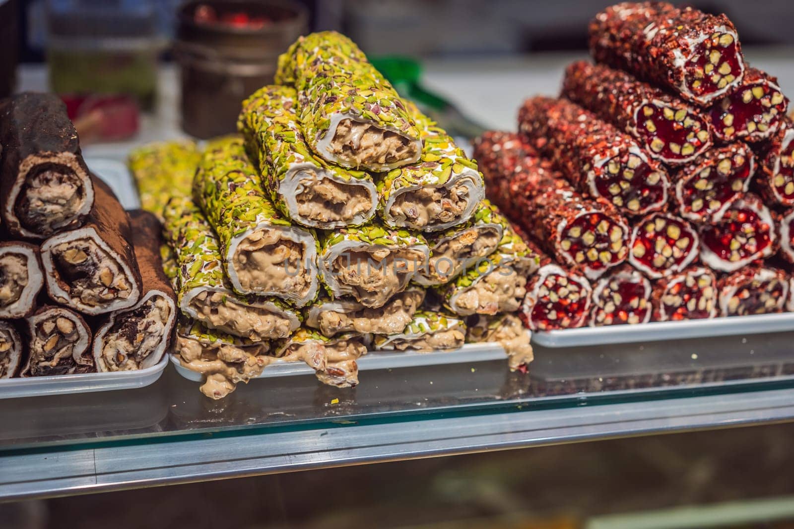 Traditional oriental sweet pastry cookies, nuts, dried fruits, pastilles, marmalade, Turkish desert with sugar, honey and pistachio, in display at a street food market by galitskaya