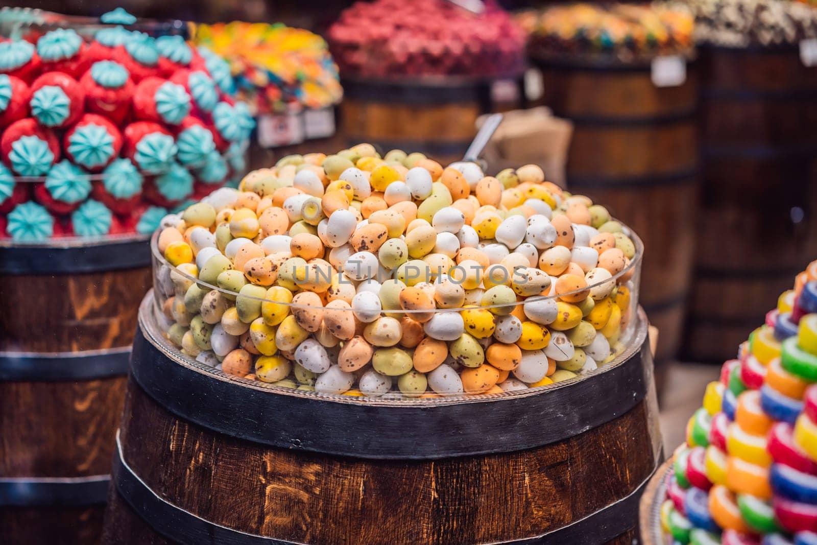 Traditional oriental sweet pastry cookies, nuts, dried fruits, pastilles, marmalade, Turkish desert with sugar, honey and pistachio, in display at a street food market by galitskaya