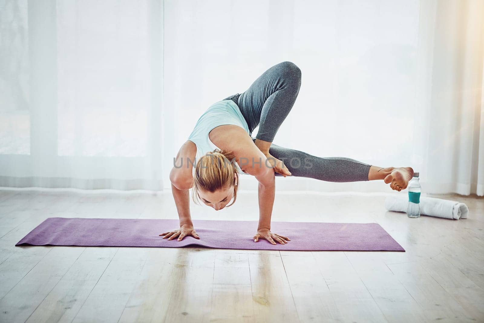 Yoga is more than just poses. an attractive woman practising her yoga routine at home