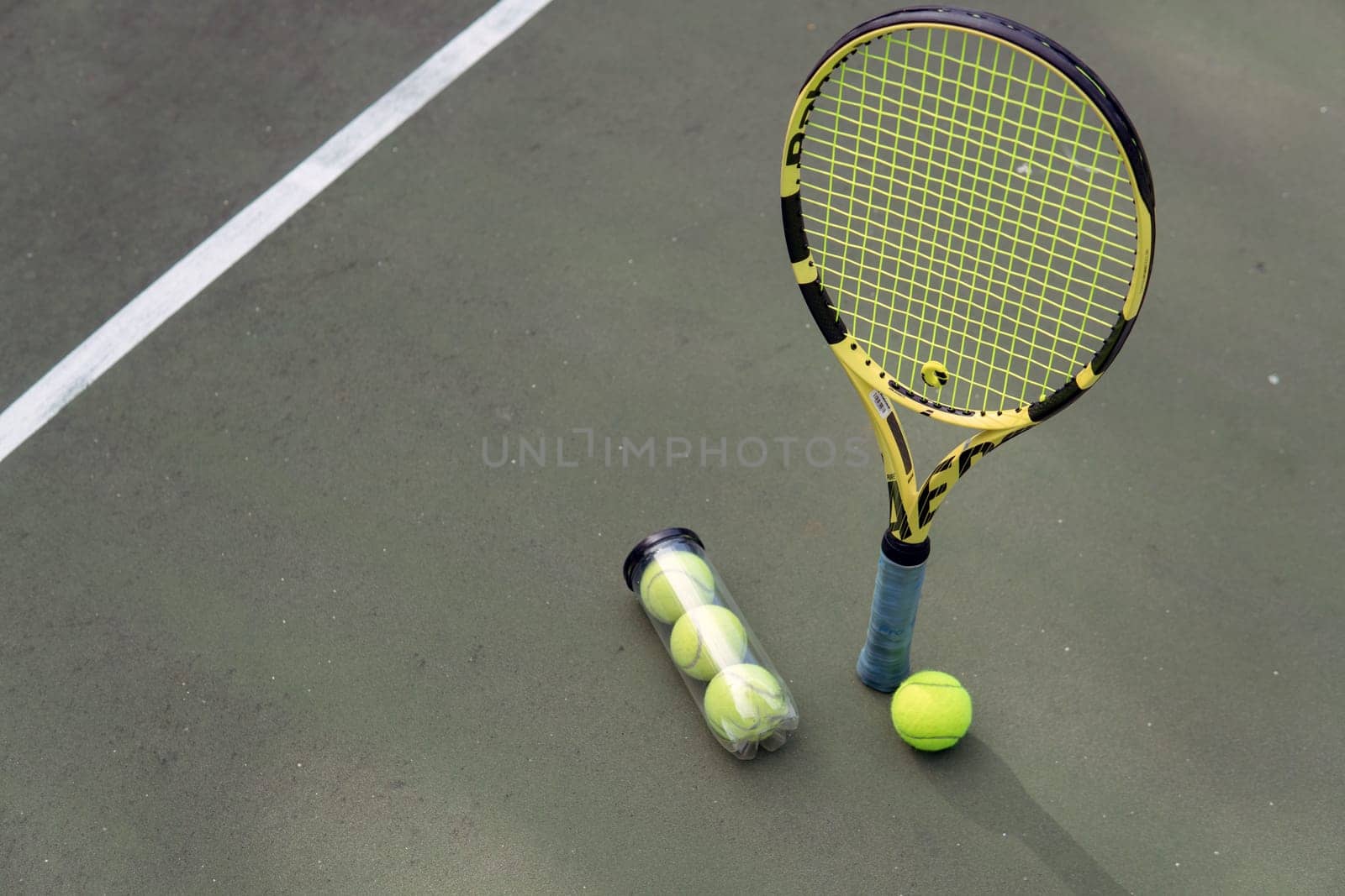 close-up. male hands holding tennis racket and balls. bali