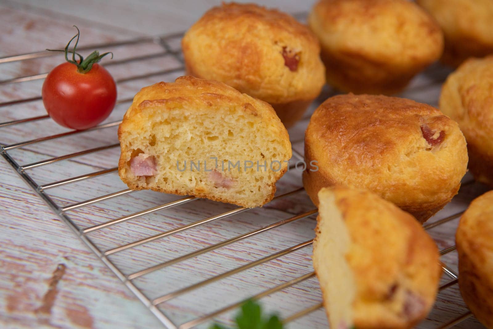 Savory muffin with ham and cheese on blue background, High quality photo